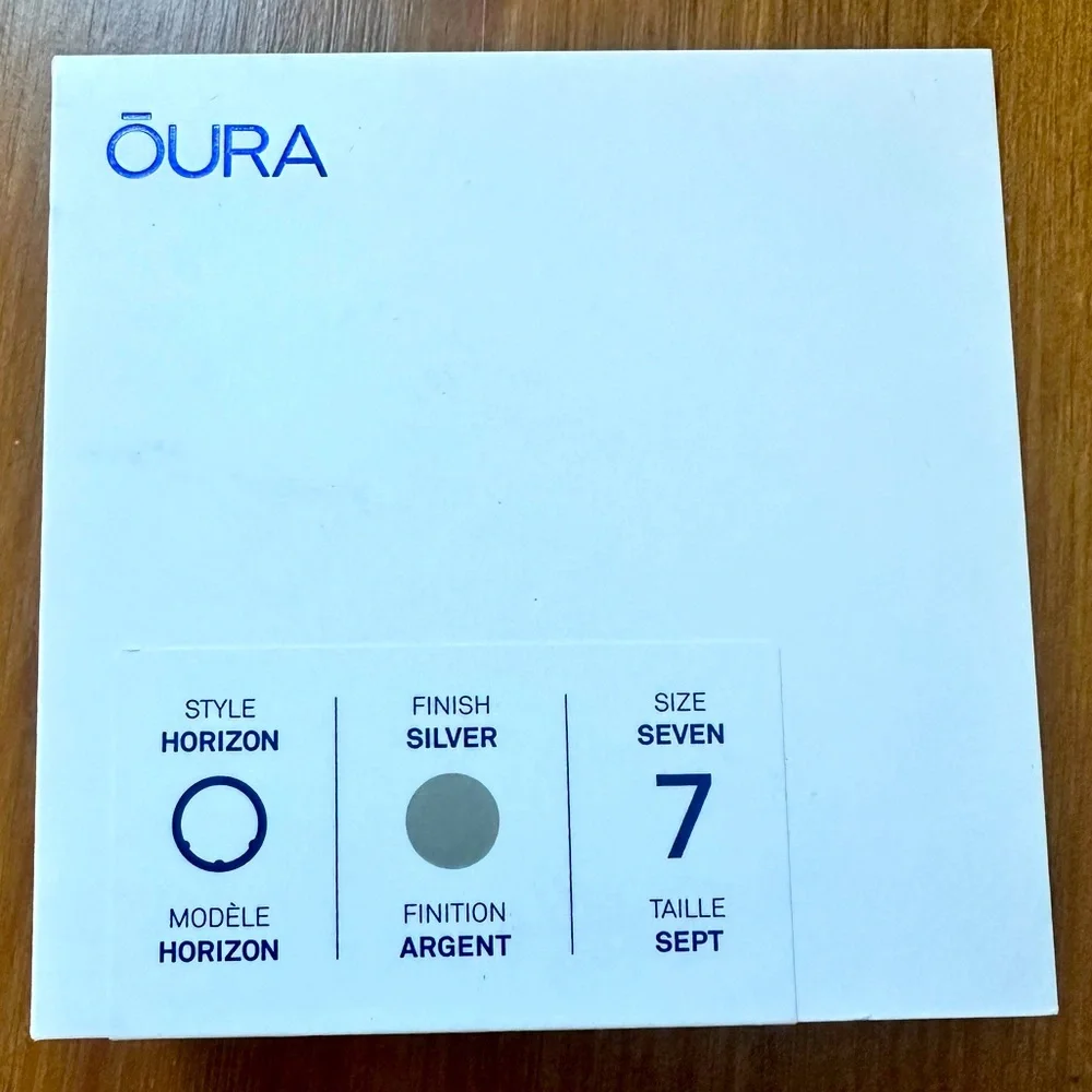 Oura Ring Charging Puck in Black with Silver Accent